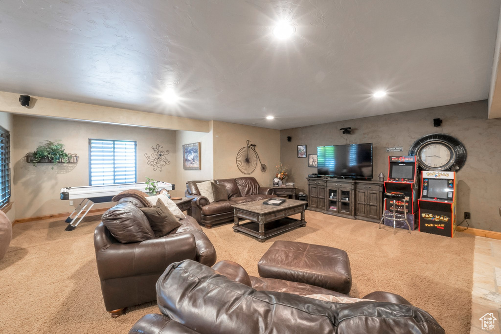 Living room with recessed lighting and light carpet