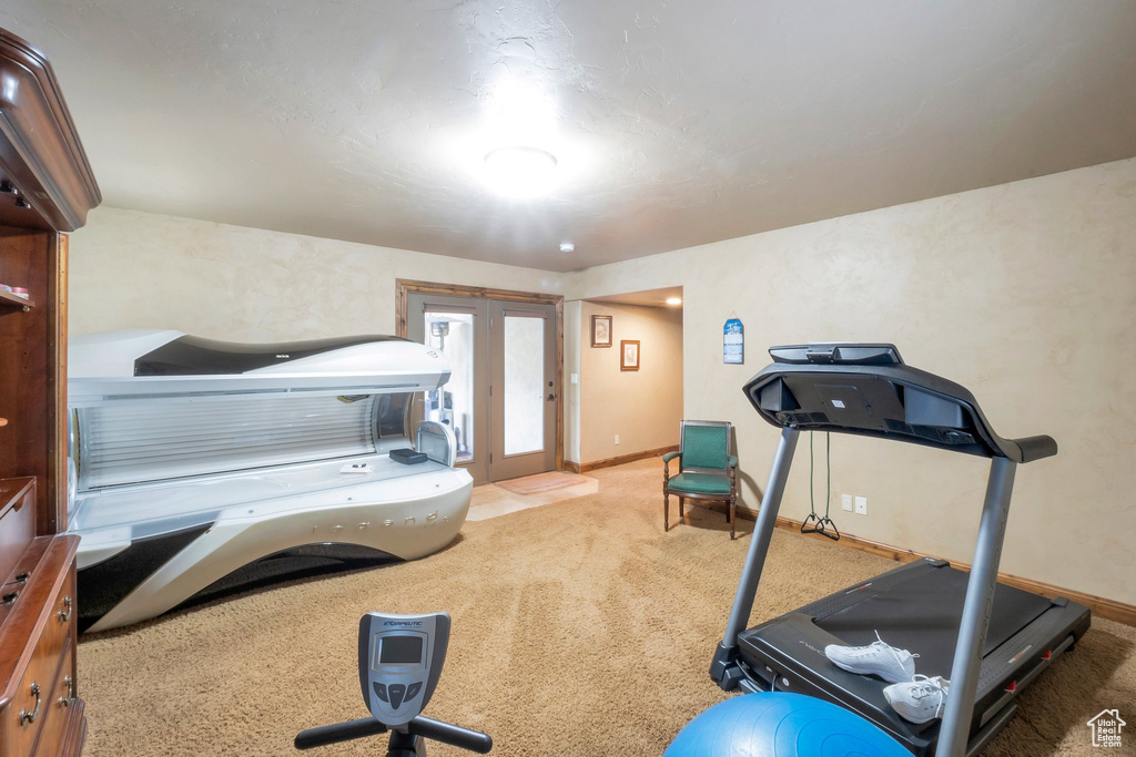 Workout room featuring carpet flooring