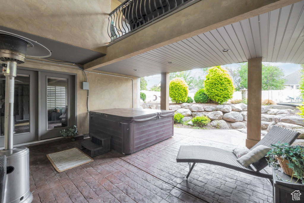View of patio / terrace with a hot tub