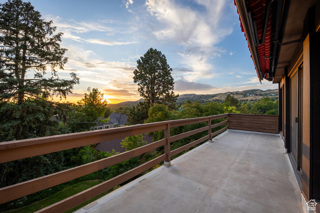 Balcony at dusk with a mountain view
