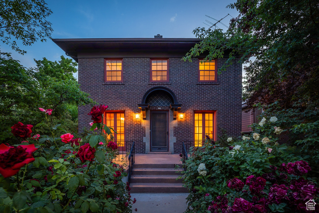 View of front of home featuring brick siding