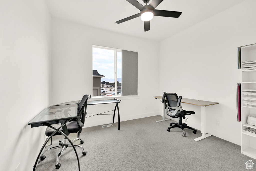 Office featuring a ceiling fan and carpet flooring