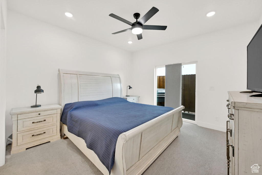 Bedroom featuring light carpet, recessed lighting, and ceiling fan