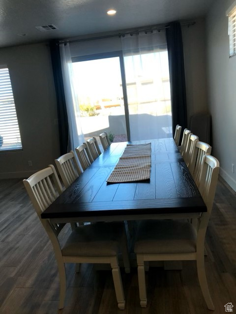Dining area featuring wood finished floors and recessed lighting