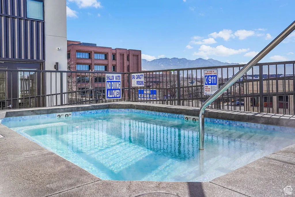 Community pool featuring a mountain view