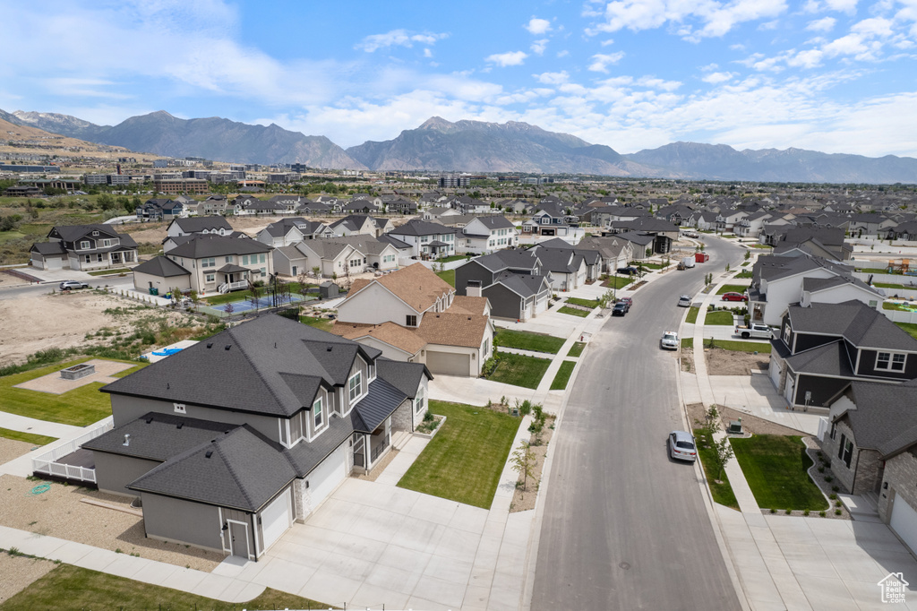 Aerial view of residential area with a mountainous background