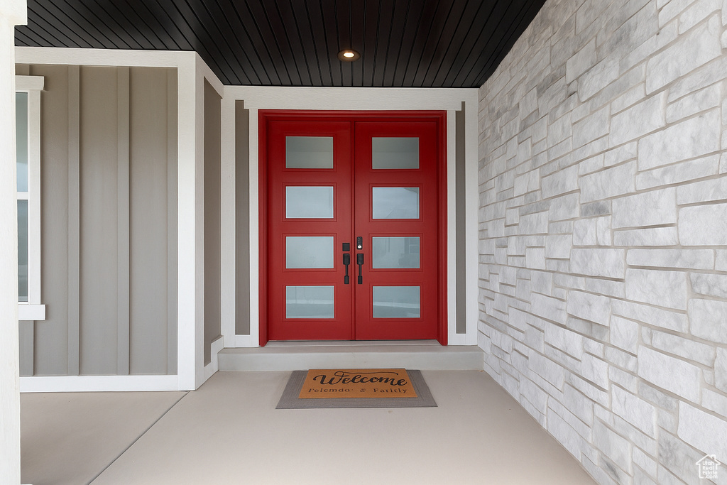 Entrance to property with board and batten siding