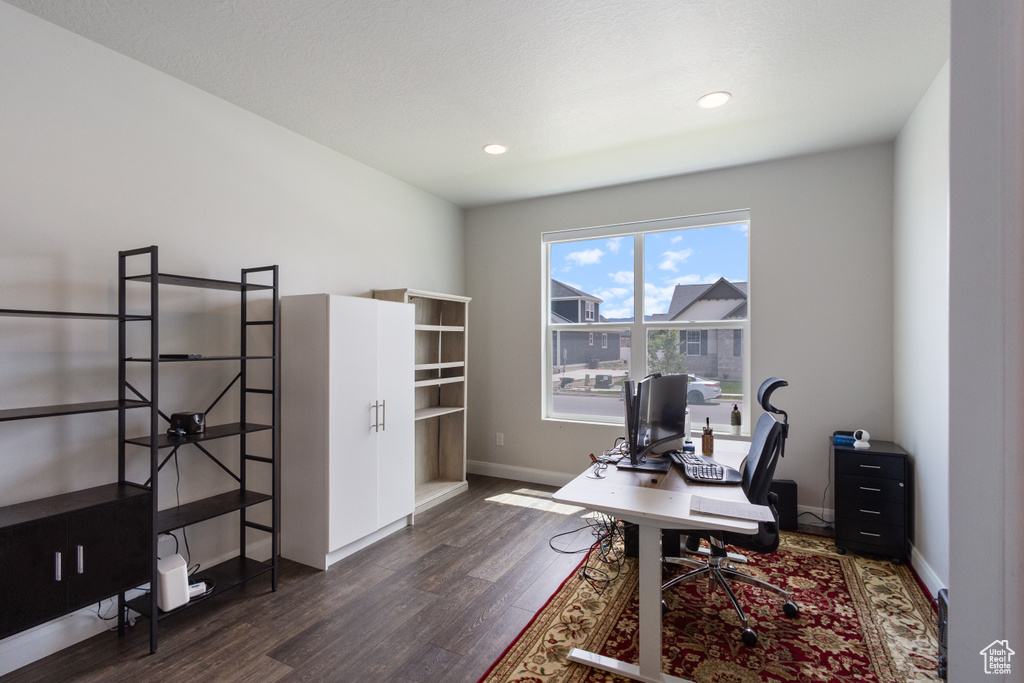 Home office featuring wood finished floors and recessed lighting