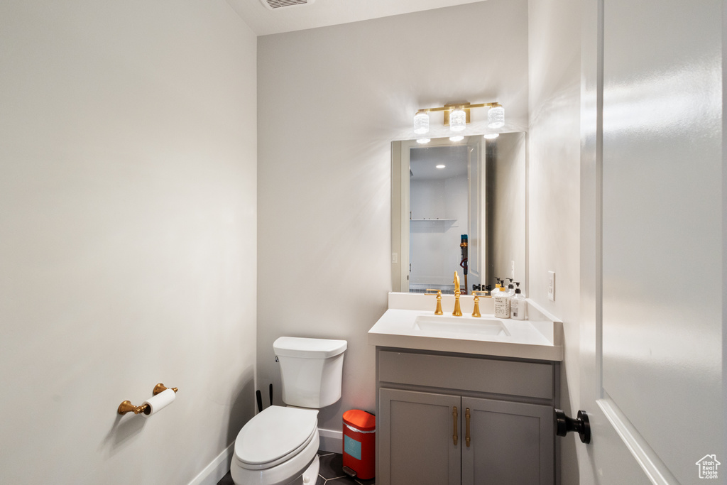 Bathroom featuring toilet and vanity