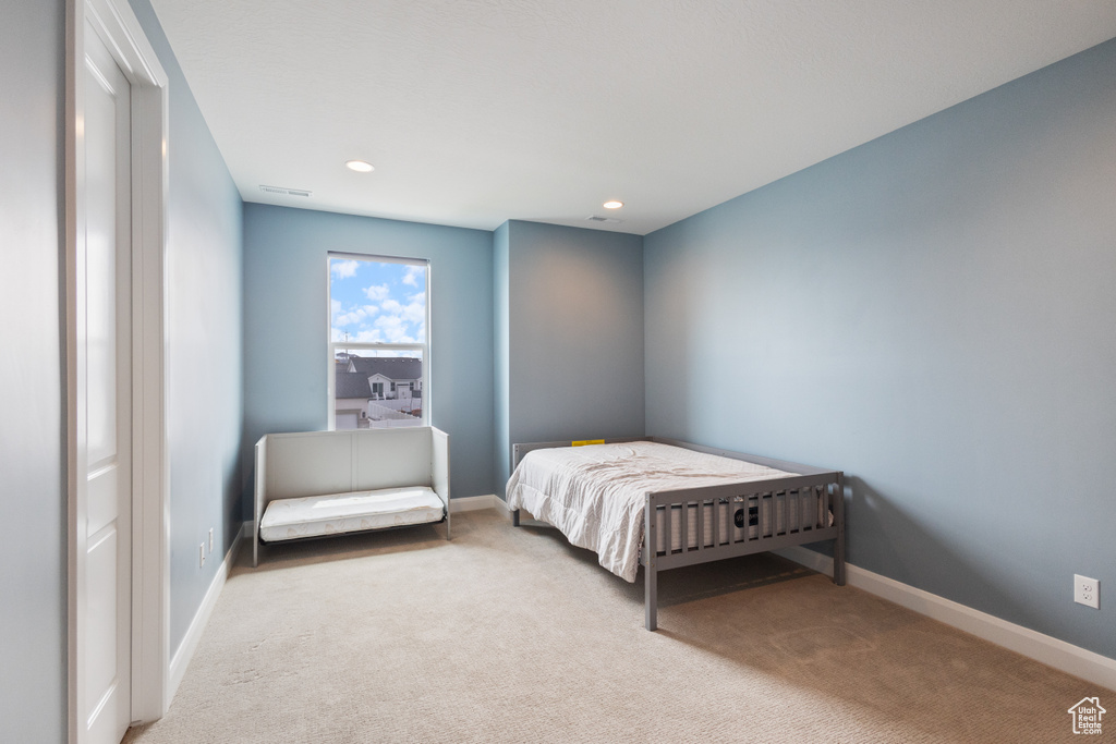 Bedroom with carpet flooring and recessed lighting