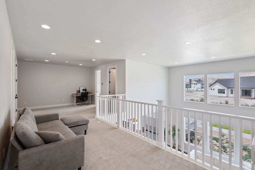 Living area featuring recessed lighting, an office area, and carpet floors