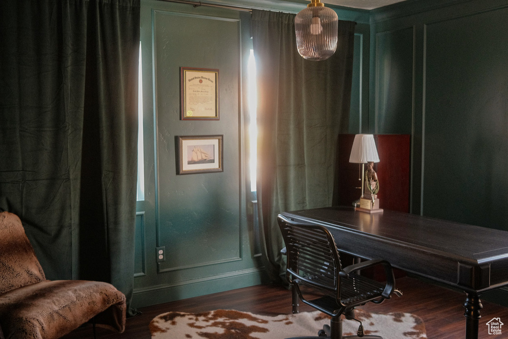 Office area with wood finished floors and baseboards