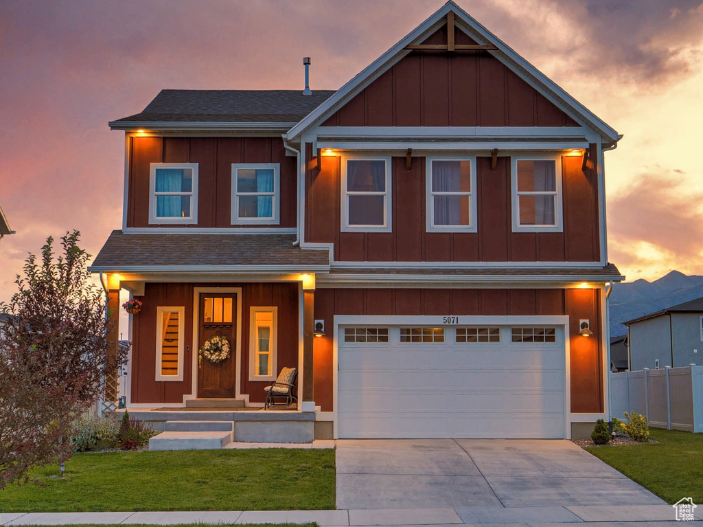 View of front of house featuring board and batten siding, a porch, concrete driveway, and an attached garage