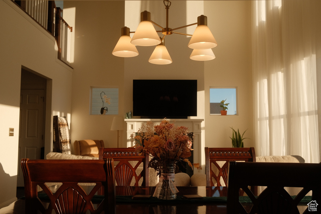 Dining area with a towering ceiling