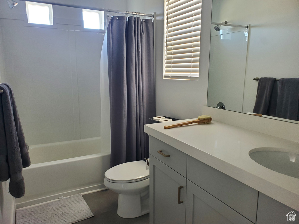 Bathroom with vanity and shower / bath combo with shower curtain