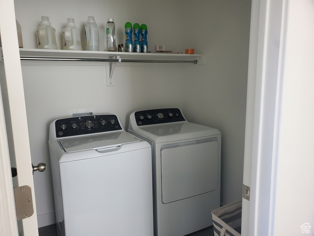 Laundry room featuring washer and clothes dryer