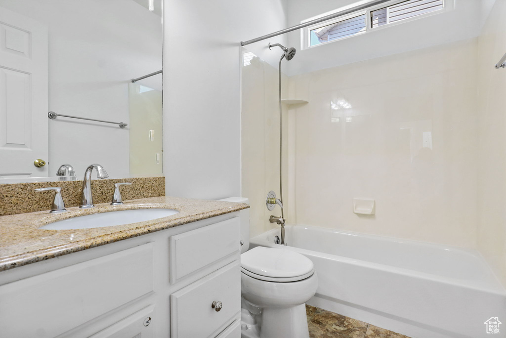 Bathroom featuring vanity and shower / washtub combination