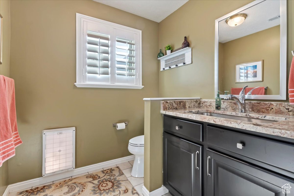 Bathroom featuring vanity and tile patterned floors