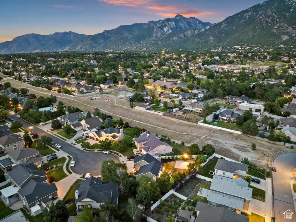 Aerial view of property\\\'s location with a mountain backdrop and nearby suburban area