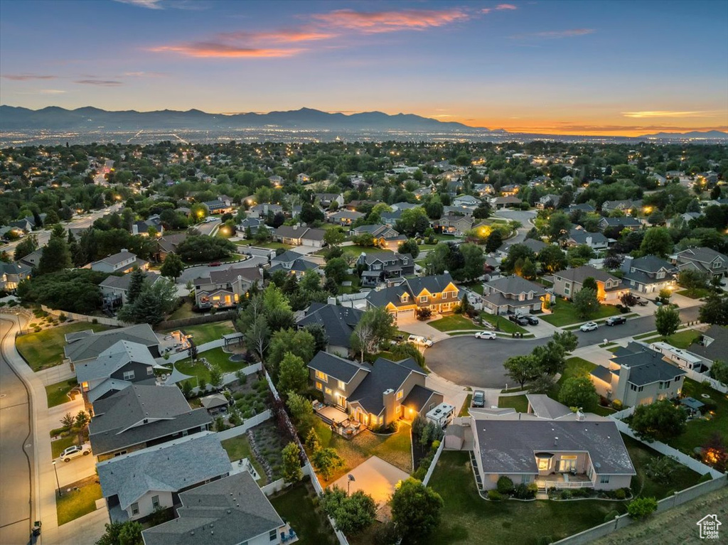 Aerial view of property\\\'s location with nearby suburban area and a mountainous background