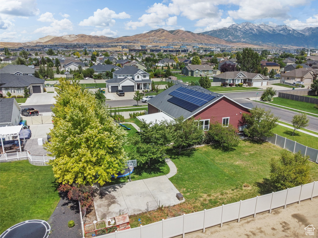 Aerial perspective of suburban area featuring a mountain backdrop