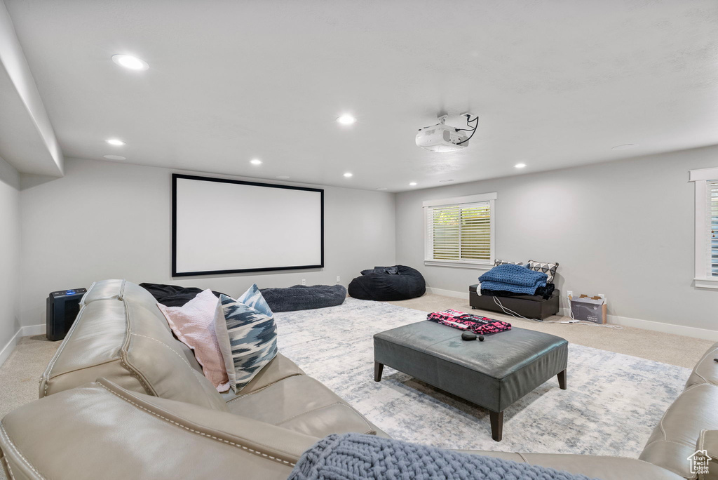 Home theater featuring carpet flooring and recessed lighting