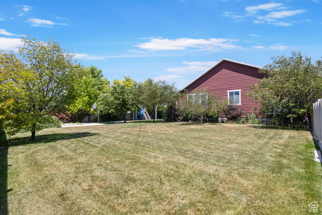 View of yard featuring a playground