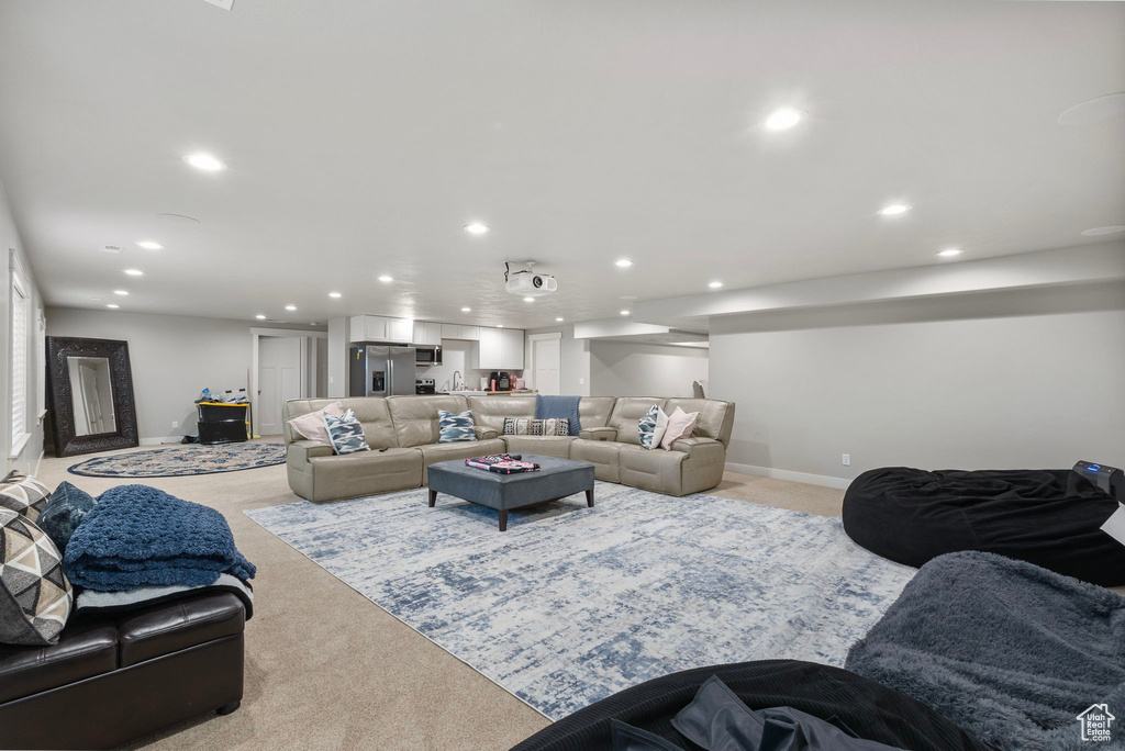 Living room featuring recessed lighting and light colored carpet