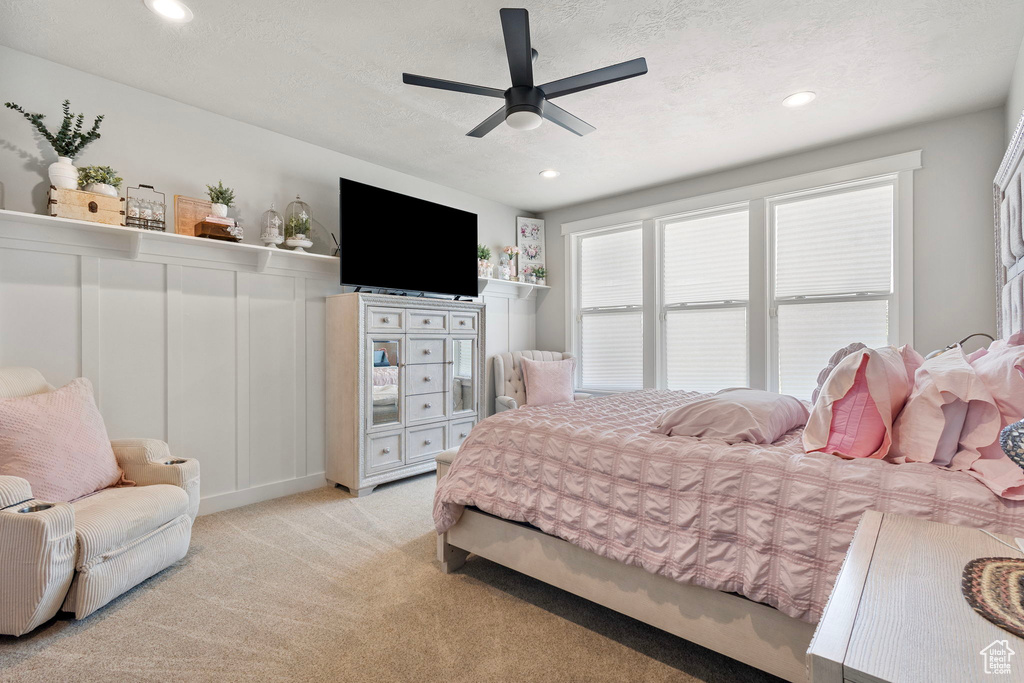 Bedroom featuring carpet, recessed lighting, ceiling fan, and a textured ceiling