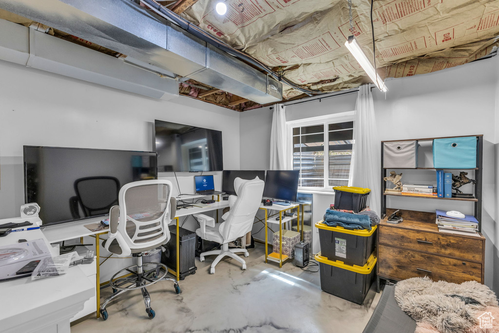 Home office with concrete flooring