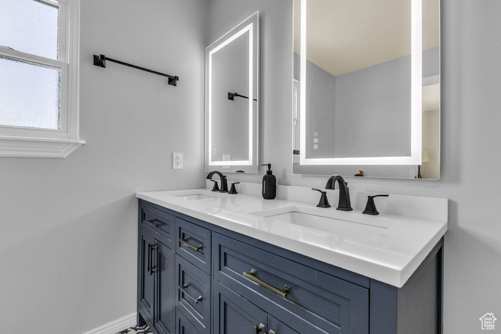 Full bath featuring double vanity