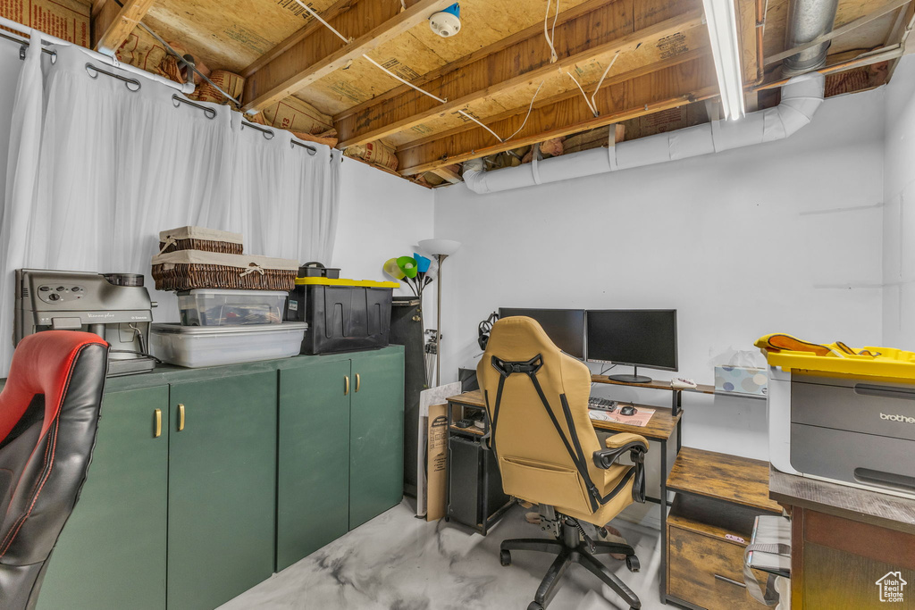 Office area featuring concrete flooring