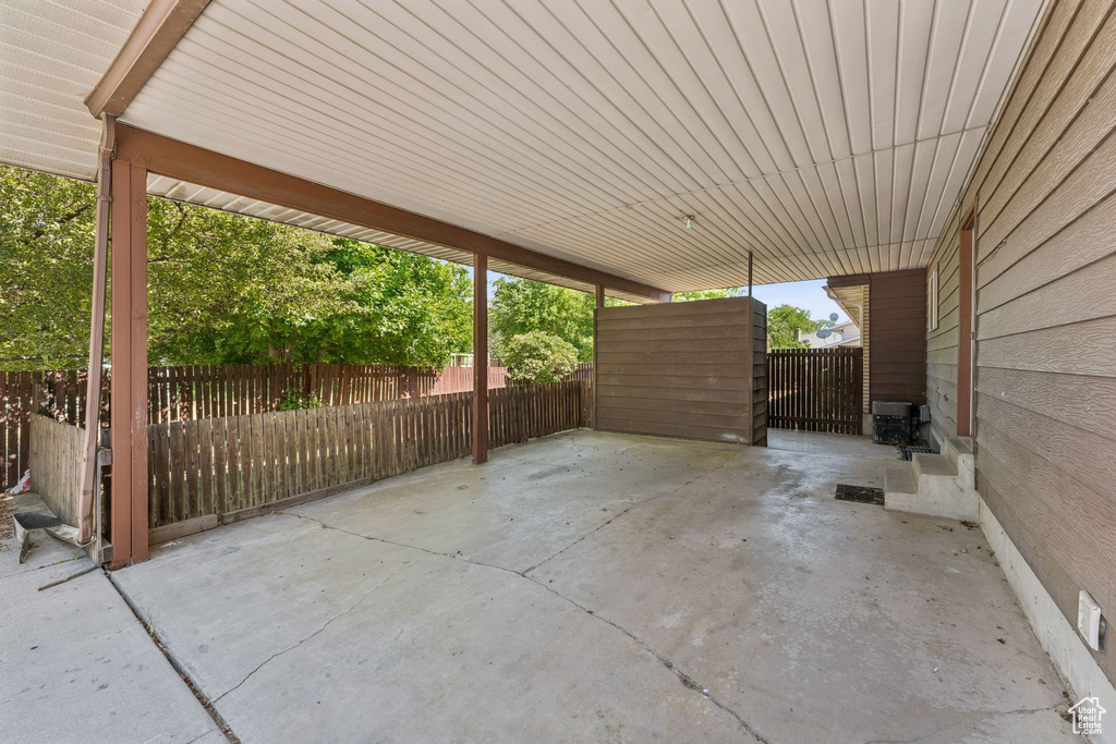View of patio with a carport