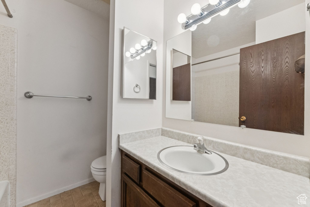 Bathroom with vanity, a shower, and a bath