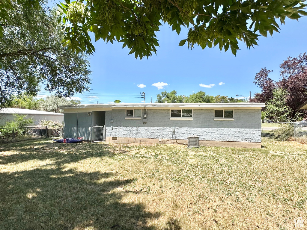 Back of house with crawl space