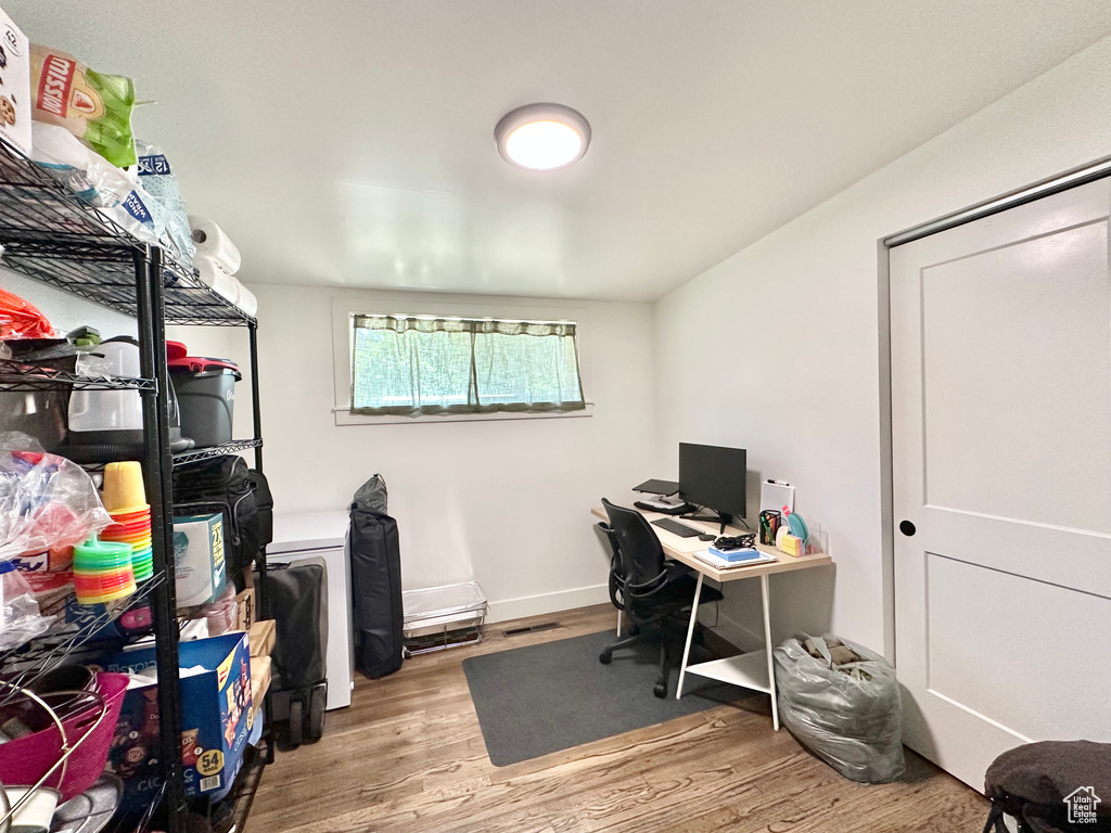 Office space featuring wood finished floors