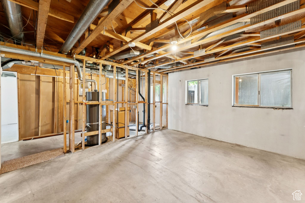 Below grade area featuring water heater