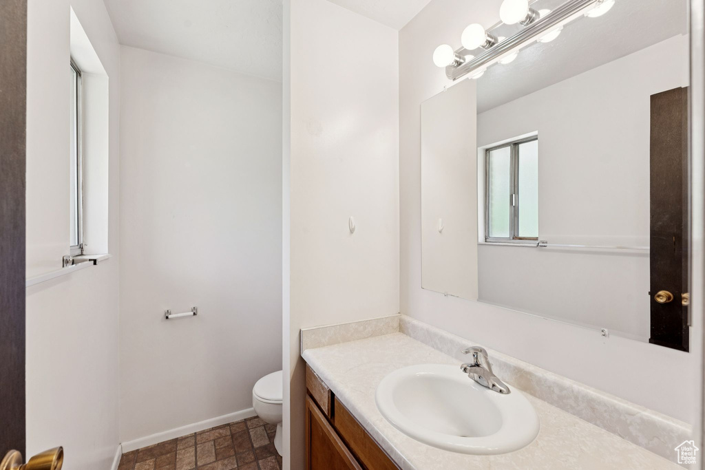 Bathroom featuring toilet and vanity