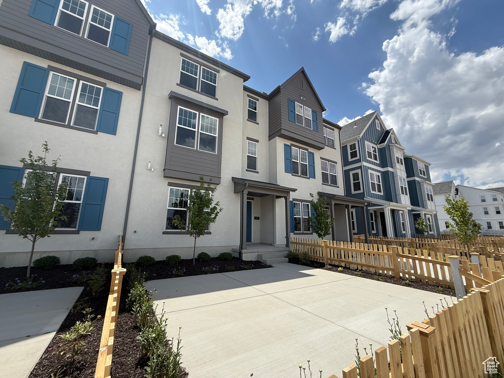 Multi unit property with a residential view and stucco siding