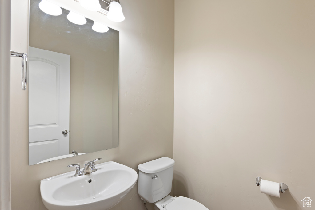 Bathroom featuring a sink and toilet