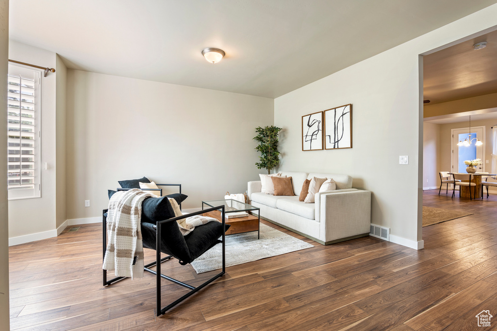 Living area featuring hardwood / wood-style floors and baseboards