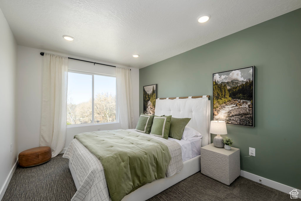 Carpeted bedroom featuring baseboards and recessed lighting