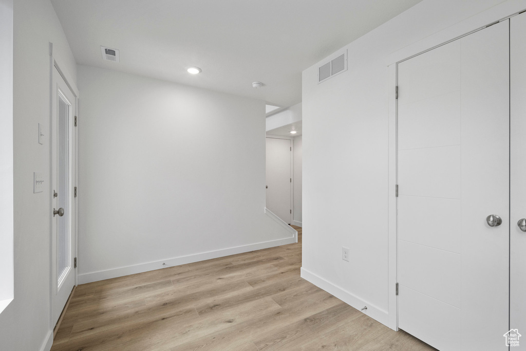 Unfurnished bedroom featuring recessed lighting, light wood finished floors, and a closet