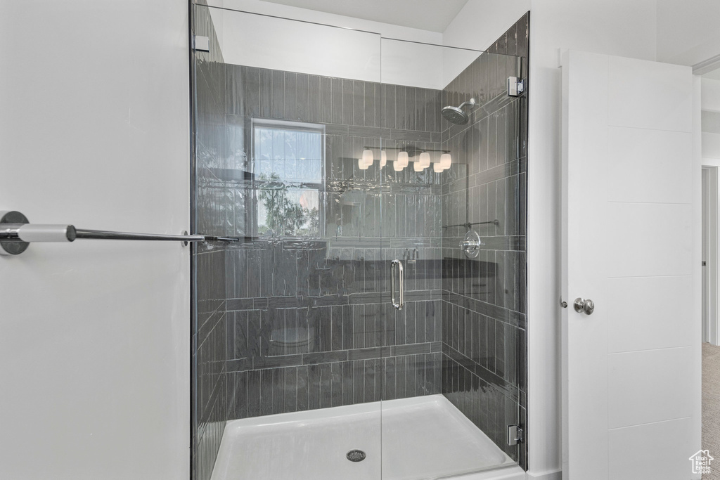 Full bath featuring a shower stall