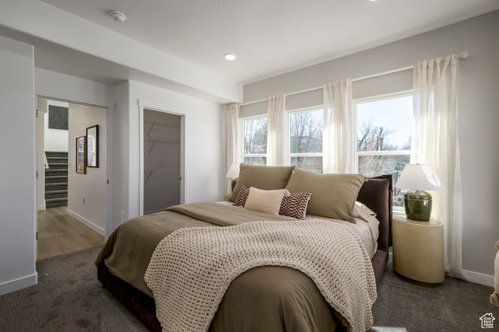 Bedroom with recessed lighting, a closet, and a spacious closet