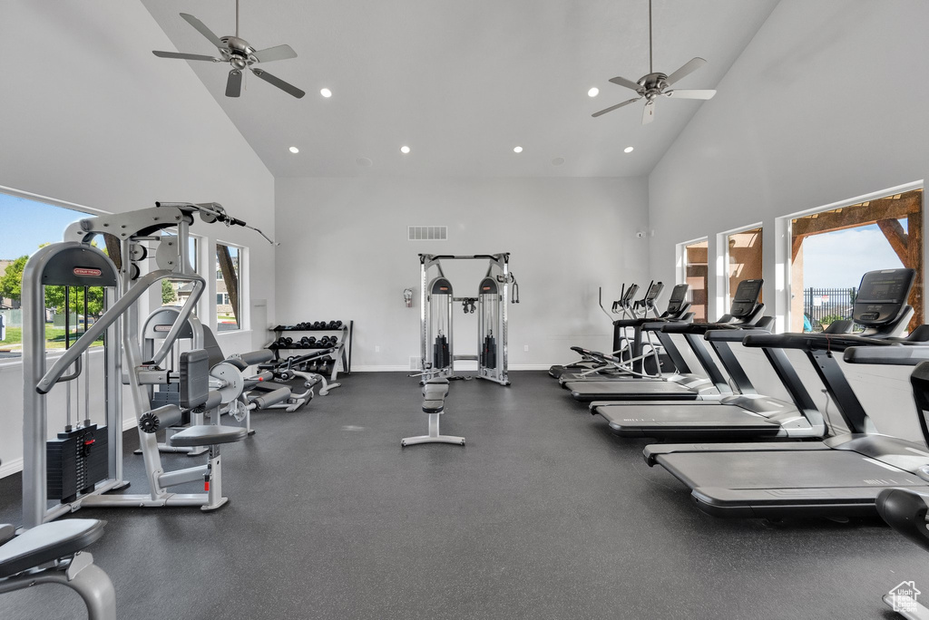 Gym featuring high vaulted ceiling, a ceiling fan, and recessed lighting