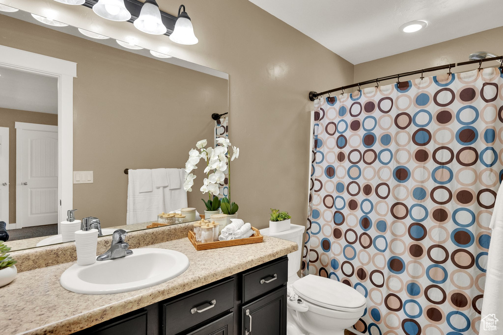 Bathroom with vanity and a shower with shower curtain