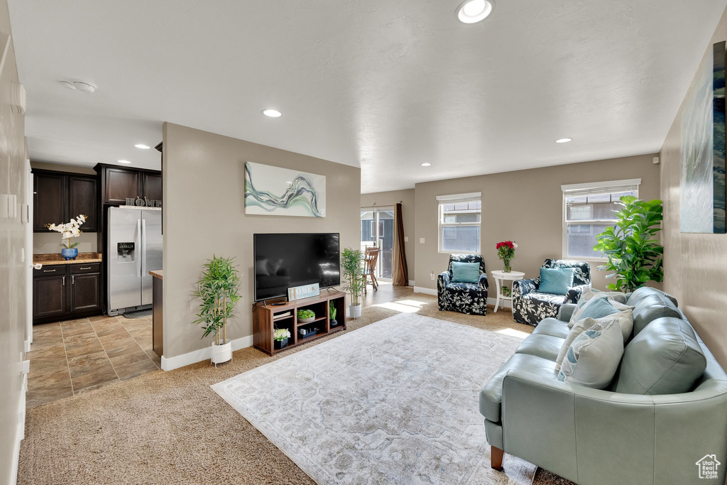 Living area with baseboards and recessed lighting