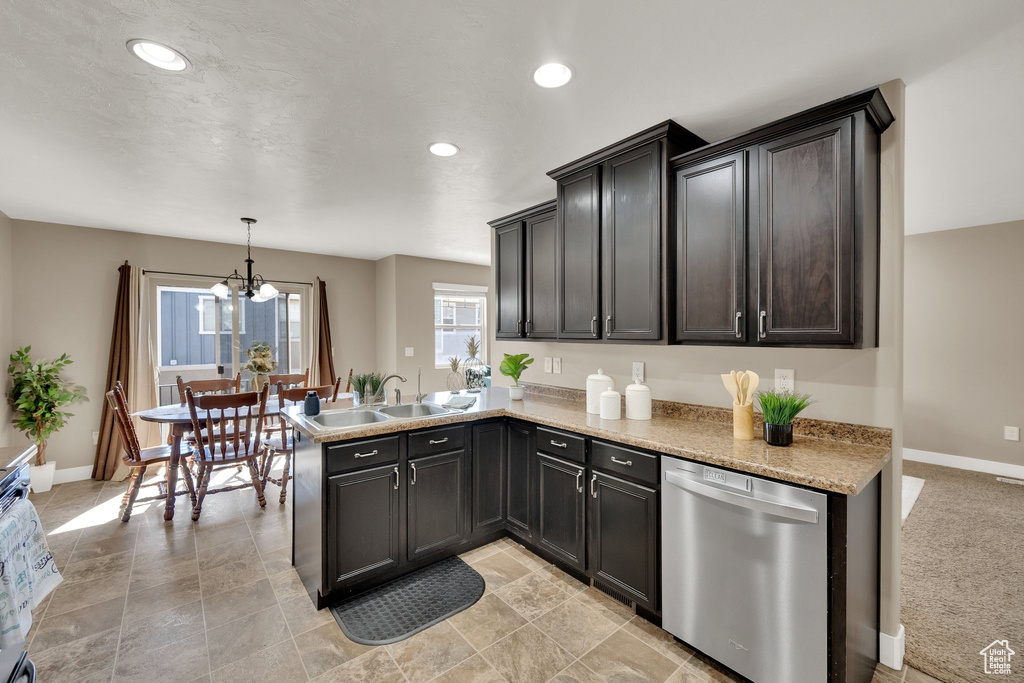 Kitchen featuring dishwasher, a chandelier, recessed lighting, a peninsula, and hanging light fixtures