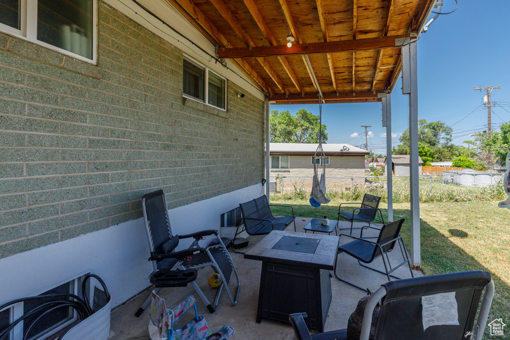View of patio featuring a fire pit